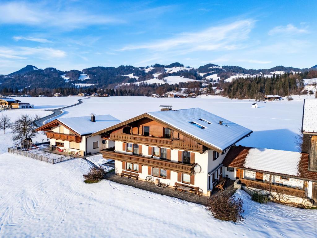an aerial view of a house in the snow at Bauernhof Grafenhof in Ebbs