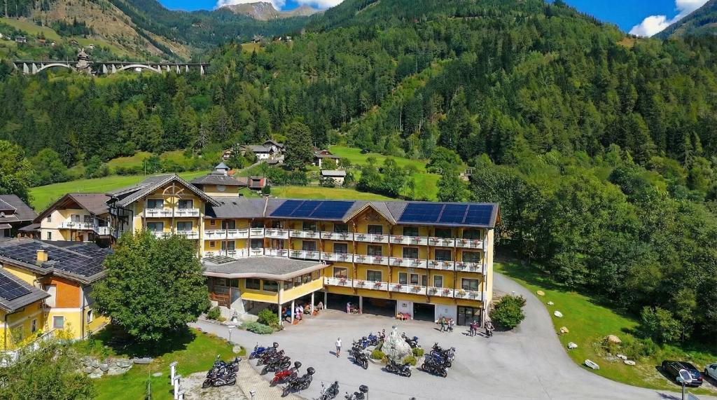 an aerial view of a hotel in the mountains at Erlebnishotel Kärnten-Mölltal 3 Stern Superior in Obervellach
