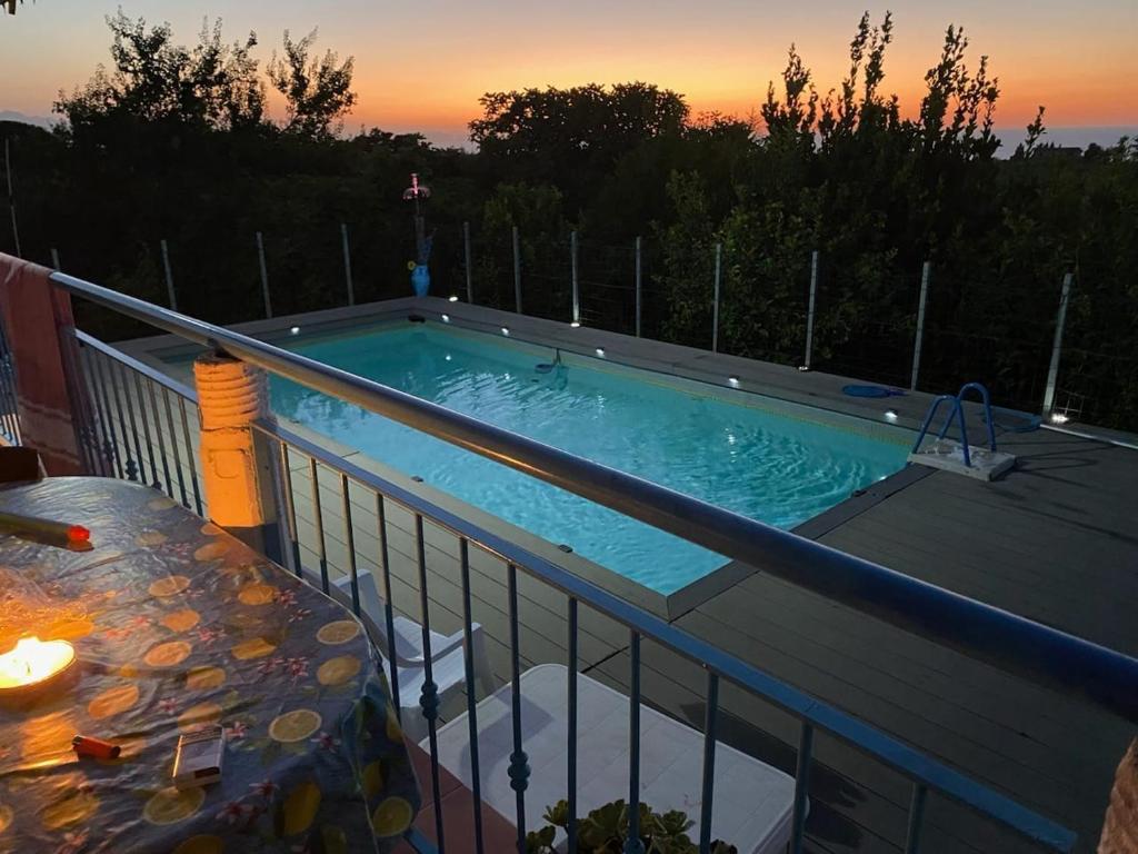 a swimming pool on the balcony of a house at Holiday Homes in Campofelice di Roccella