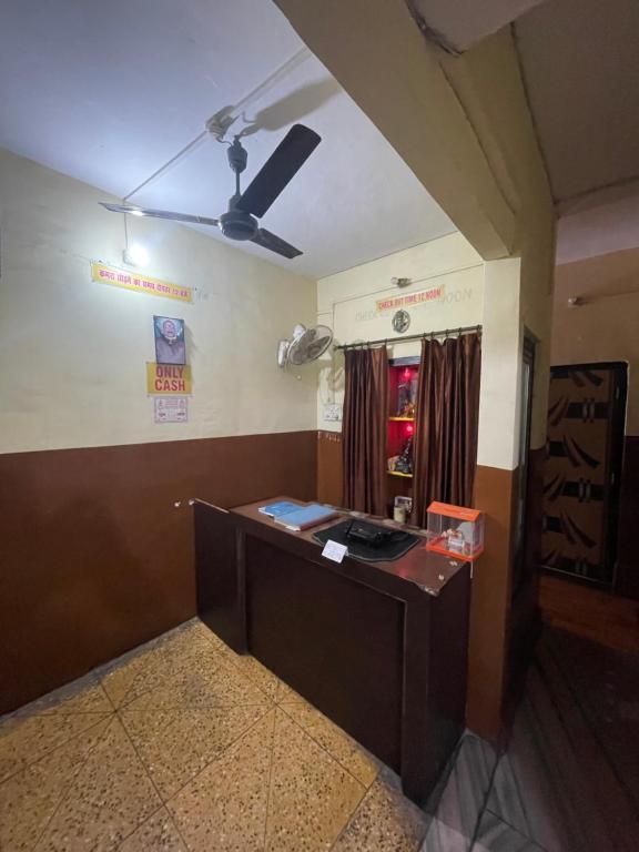 a room with a desk in a room at Shivangi hotel in Bareilly