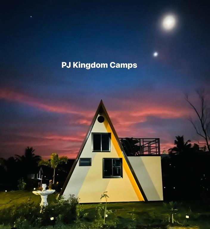 a house with the moon in the sky at พีเจ คิงดอม โฮมสเตย์ in Buriram