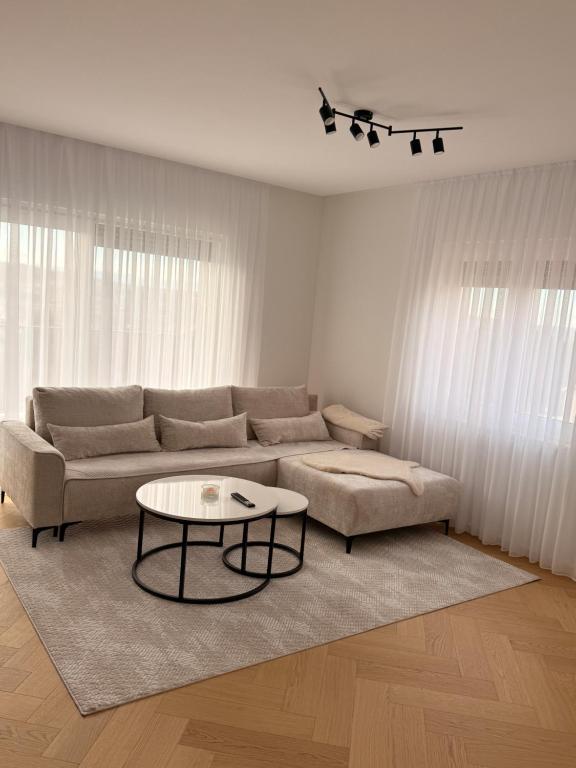 a living room with a couch and a table at Apartman Sara in Posušje