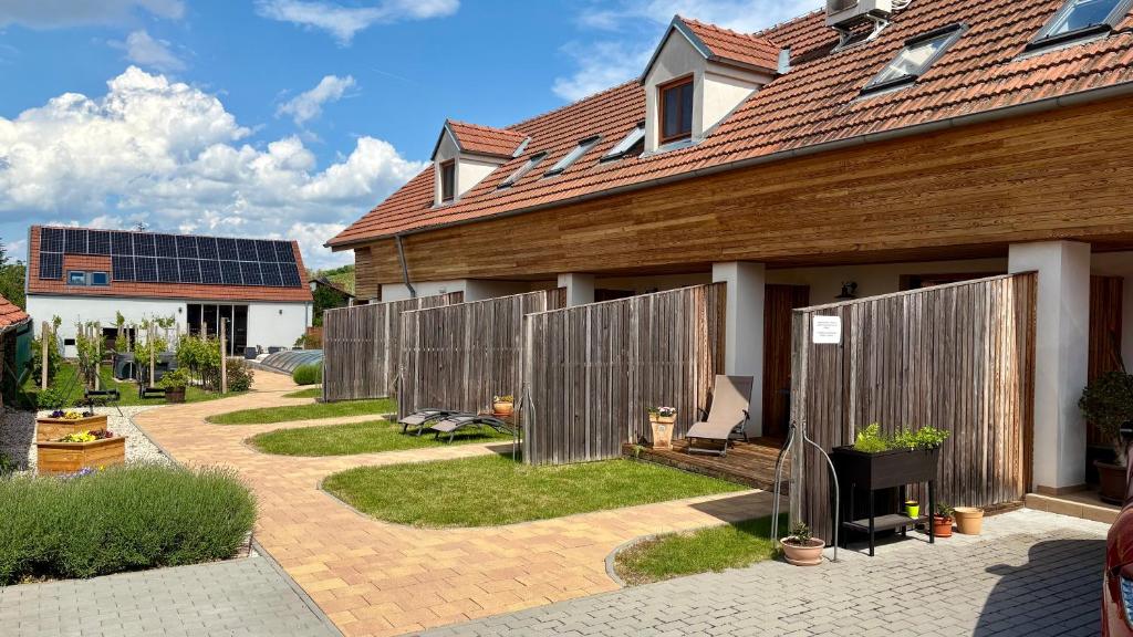 a backyard of a house with a fence at Rezidence Věstonice in Horní Věstonice