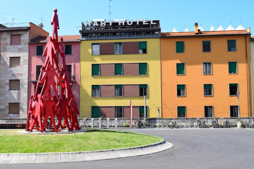 a red sculpture in front of a building at Hotel Mary in La Spezia