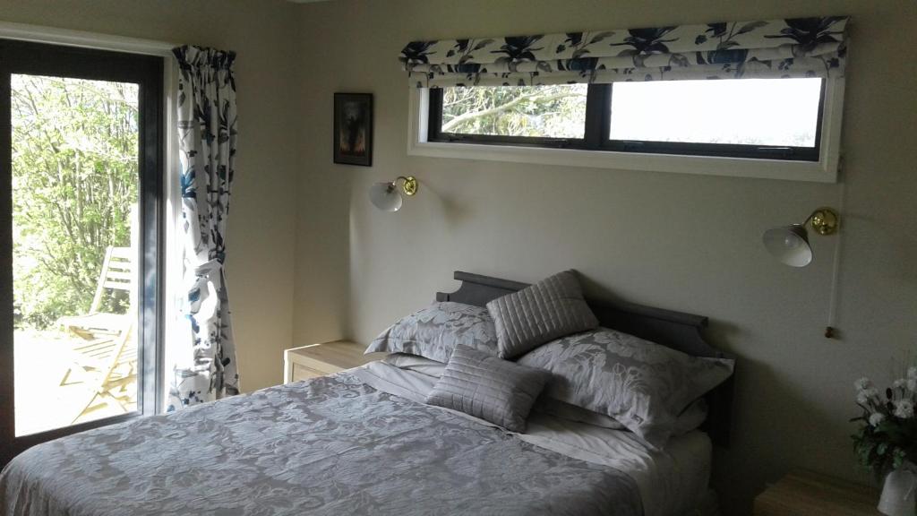 Postel nebo postele na pokoji v ubytování Omaka Heights Countrystay