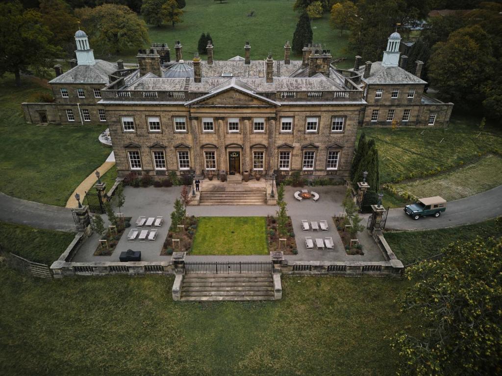 an aerial view of a large house with a large yard at Denton Hall in Ilkley