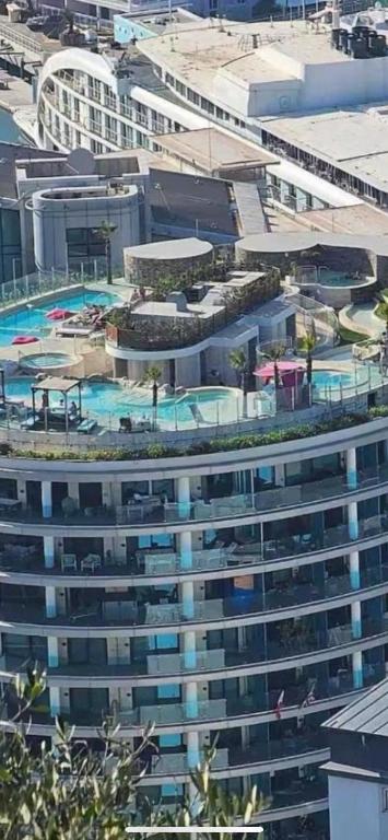 an overhead view of a large building with a swimming pool at Gibraltar Luxe Stay 1403 in Gibraltar