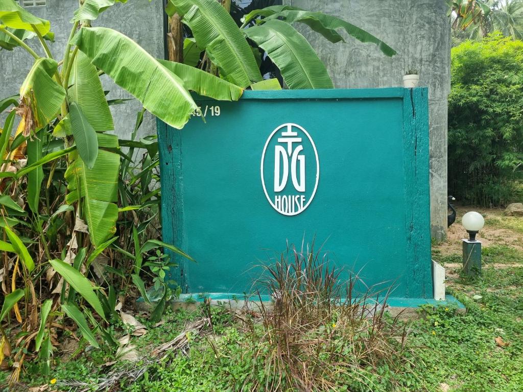 a blue recycling box with the dc comics logo on it at DG House in Thong Sala