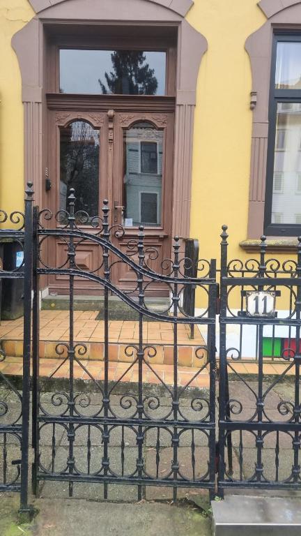 a black iron fence in front of a house at Apartment 11 A in BRE