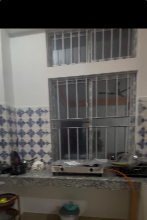 a window with bars on it in a kitchen at Jinkos Homestay with self cooking facility in Itānagar