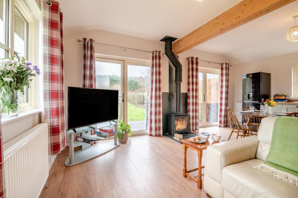a living room with a couch and a tv at 2 Bed in Coaley oc-r34730 in Coaley