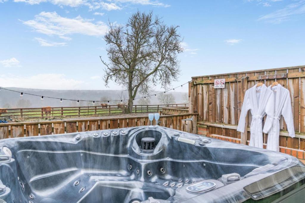 a bath tub sitting on the deck of a house at 2 Bed in Escomb oc-o34978 in Acomb