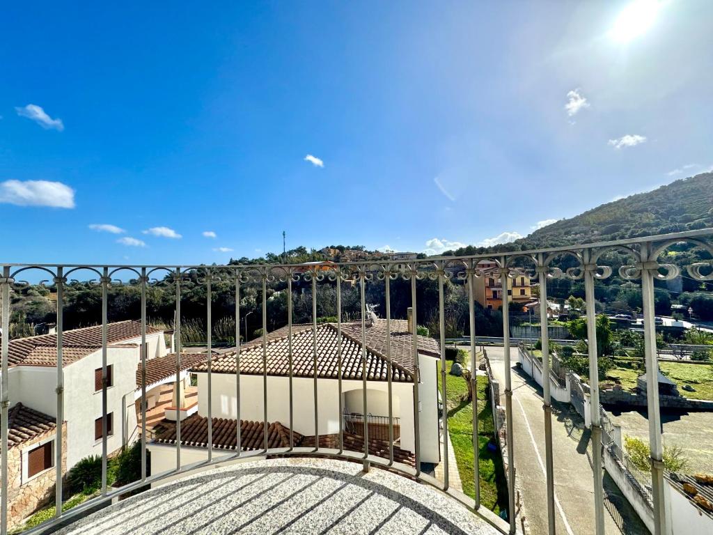 arial view of a building with mountains in the background at Skyline Balcony in Loceri