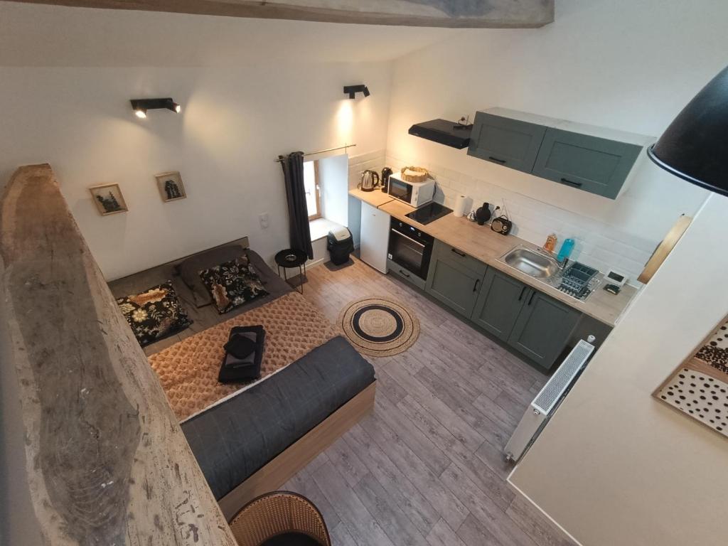 an overhead view of a living room and kitchen at Agréable studio privé avec terrasse in Olliergues