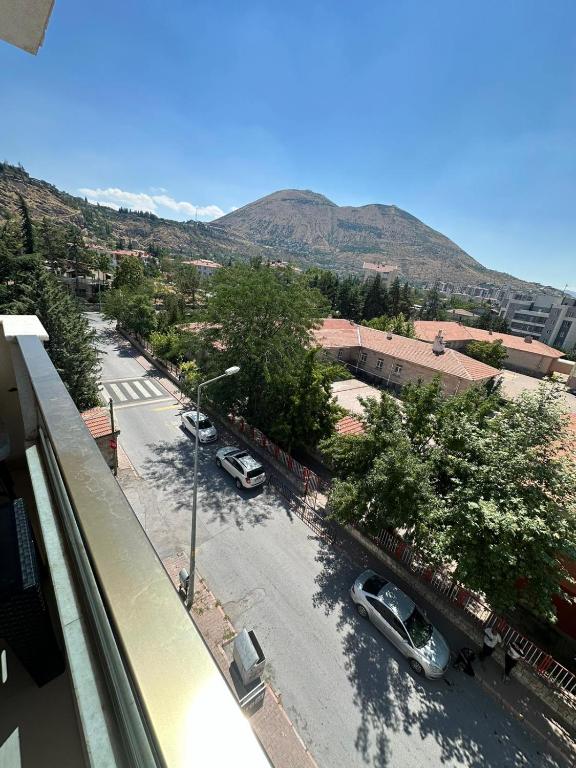 a view of a street with cars parked on the road at Zirve Suit Rezidans in Talas