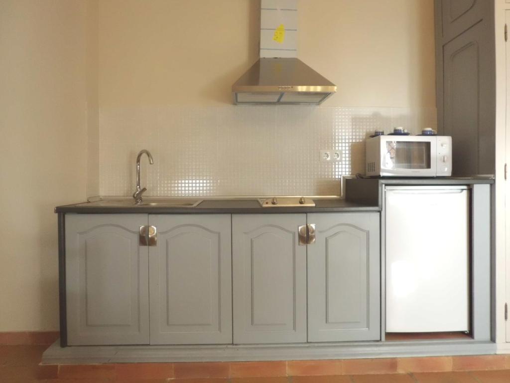 Kuchyň nebo kuchyňský kout v ubytování Apartamentos Baeza RN