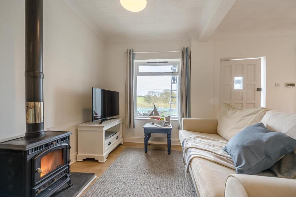 a living room with a couch and a stove at 2 Bed in Bishopston oc-h28996 in Bishopston