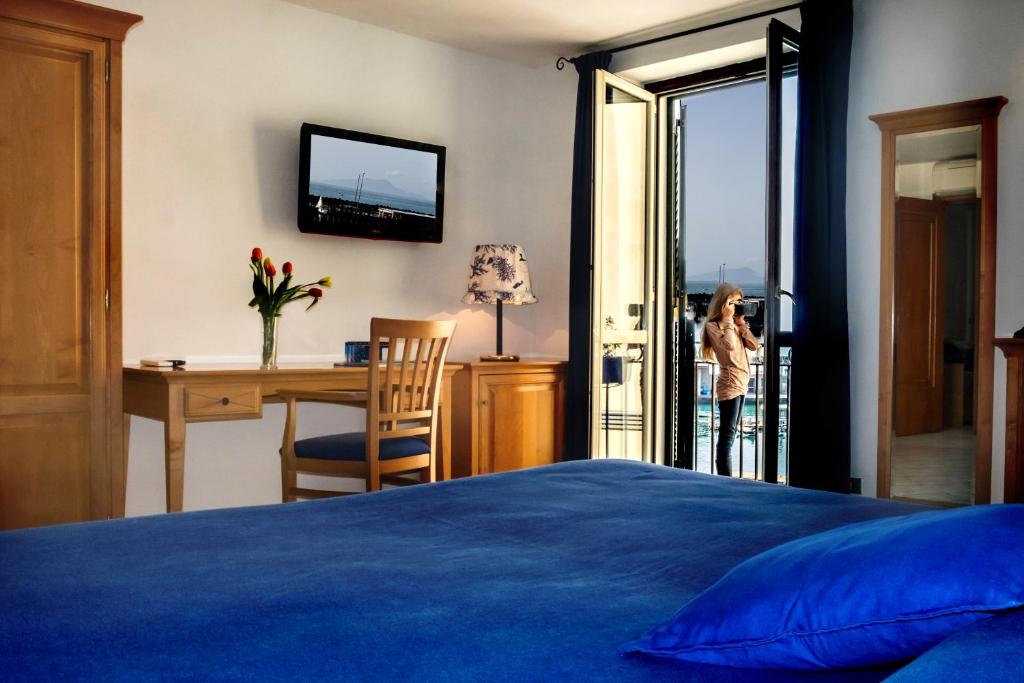 Postel nebo postele na pokoji v ubytování B&B L'Approdo