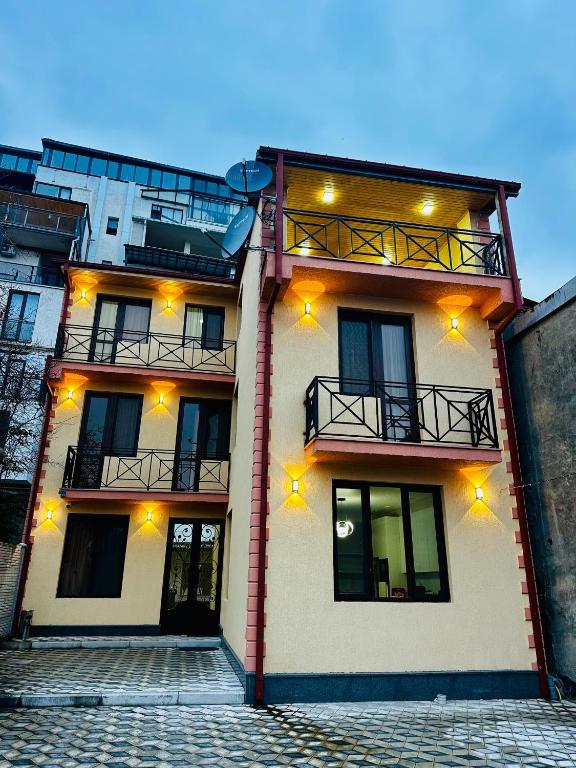 a building with lights on the side of it at City Star Kutaisi in Kutaisi