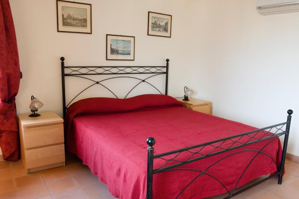 Letto o letti in una camera di La Residenza di Carolina