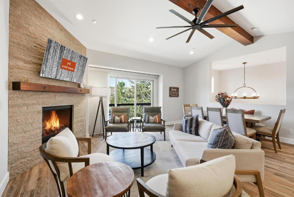 a living room with a couch and a fireplace at Snowline at Black Rock Ridge in Kamas