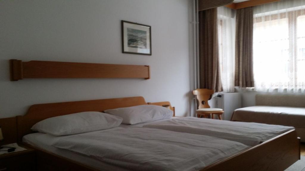 Postel nebo postele na pokoji v ubytování Pension Buchner
