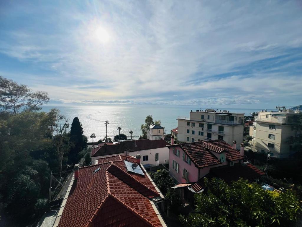 a view of a city with buildings and the ocean at Suite La Brezza - Luxury Sanremo in Sanremo