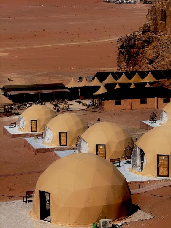 a group of tents in the desert at Luxury Camp Wadi Rum in Disah