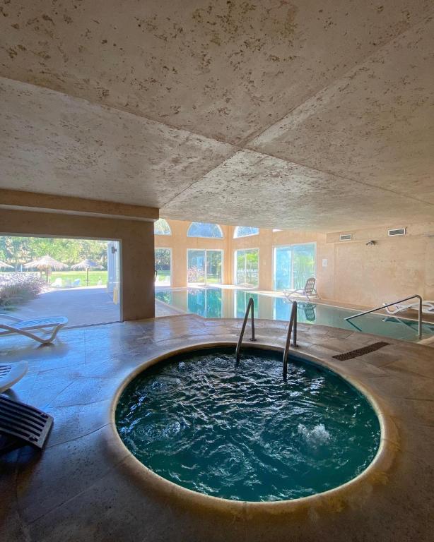 a room with a large pool of water in a house at Howard Johnson Pilar Resort Spa & Convention Center in Pilar