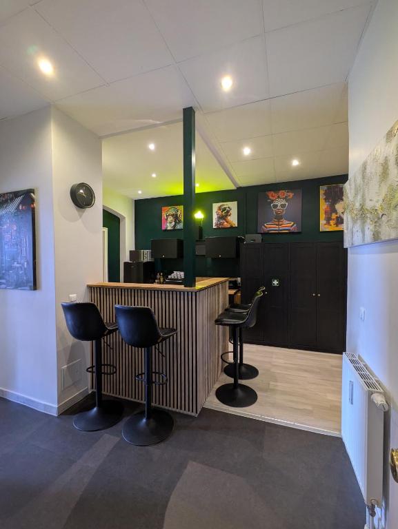 a barber shop with three chairs and a counter at Munich Apartment 110 qm with 3 Bedrooms very cetral location 1 to 10 Guests in Munich