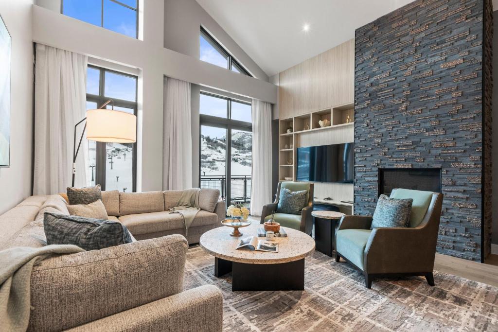 a living room with couches and a fireplace at Abode at Deer Valley East in Park City