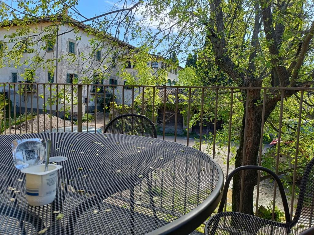 a table with a cup of coffee sitting on a patio at El Freixe de l'Ylla in Els Hostalets