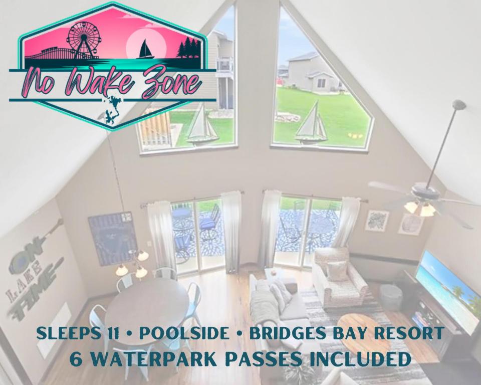 a room with a window with a sailboat on it at Bridges Bay Vacation Cabin 126 in Arnolds Park