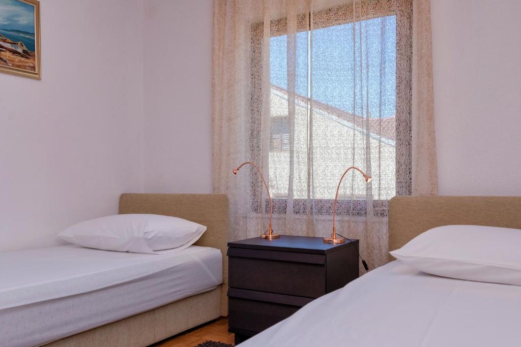 Łóżko lub łóżka w pokoju w obiekcie MI Apartment