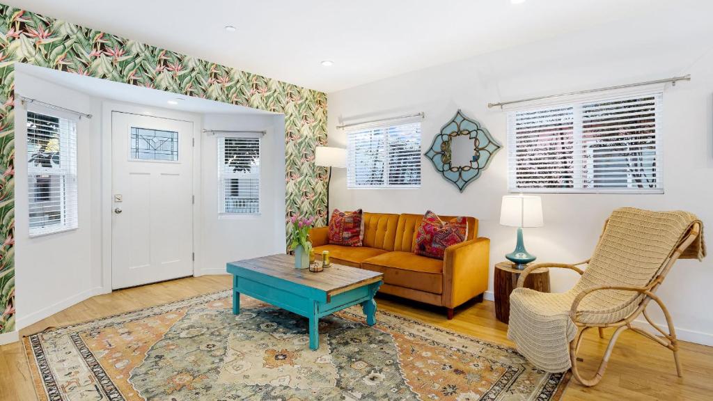 a living room with a couch and a table at Urban Jungle by AvantStay in Los Angeles