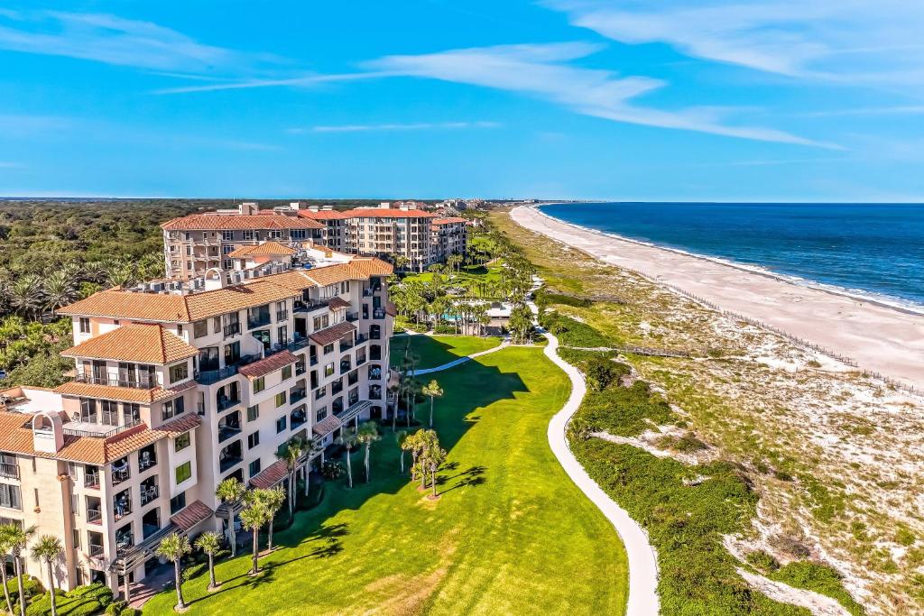 an aerial view of a resort and the beach at Oceanfront condo with panoramic views, shared pool, and private washer & dryer in Fernandina Beach