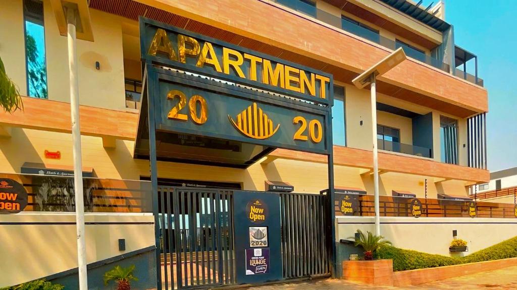 a sign on the side of a apartment building at 2020 Apartment Guzape in Chini
