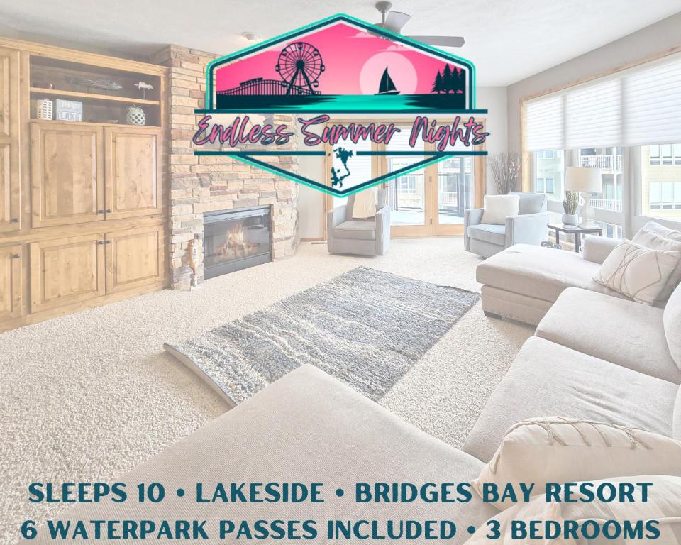 a living room with a couch and a fireplace at Bridges Bay Resort Coronado Building 302 in Arnolds Park