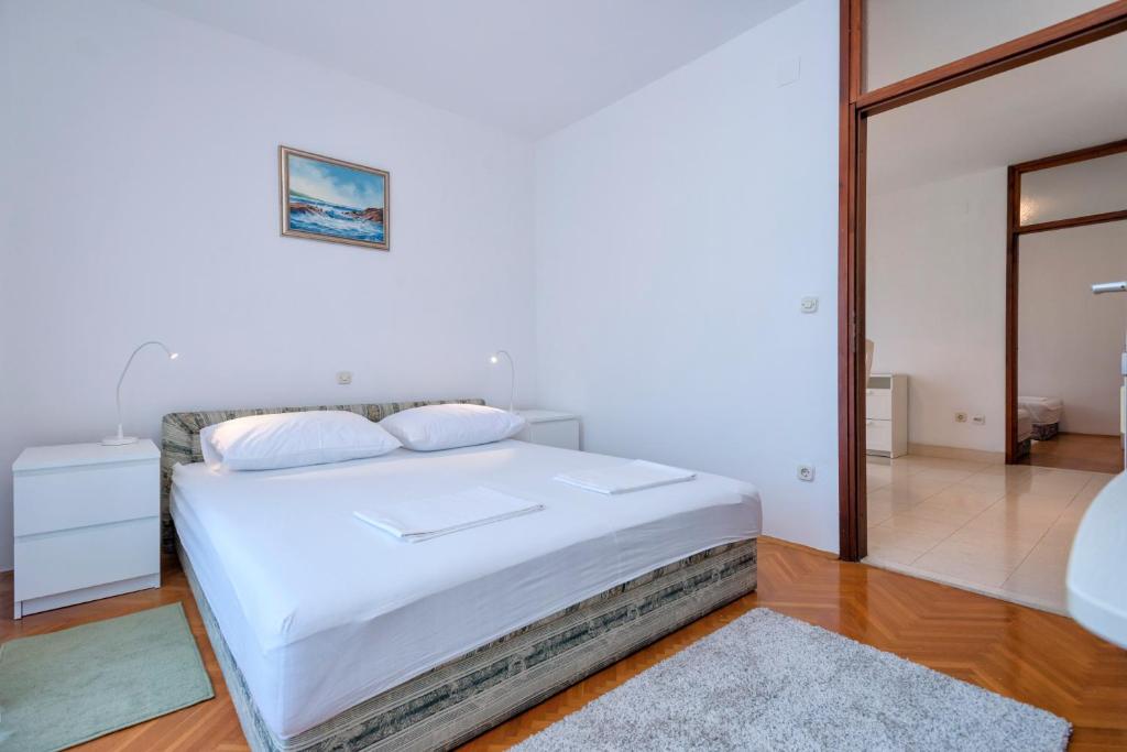 Łóżko lub łóżka w pokoju w obiekcie MI Apartment