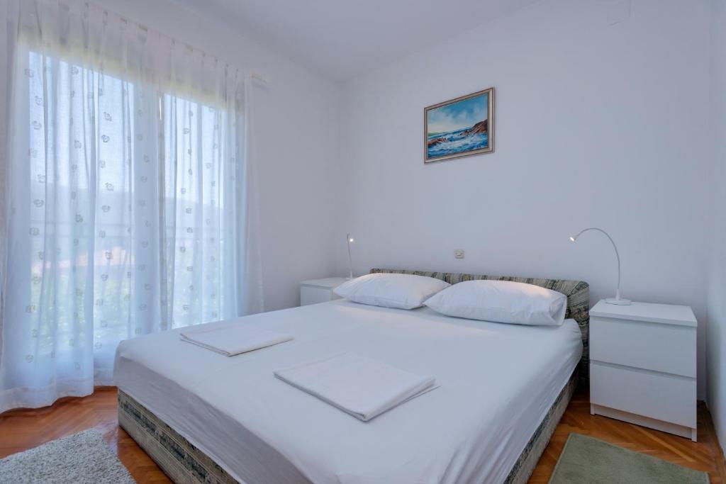 Łóżko lub łóżka w pokoju w obiekcie MI Apartment