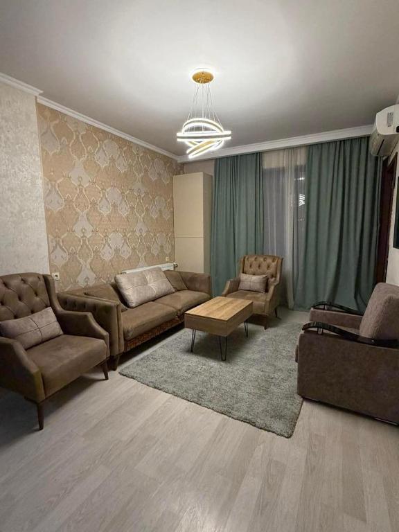 a living room with couches and chairs and a couch at City View Apartments At Dadiani St in Tbilisi City