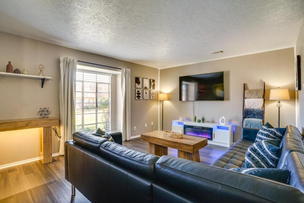 a living room with a couch and a table at Modern Comfortt Townhouse in Grand Prairie