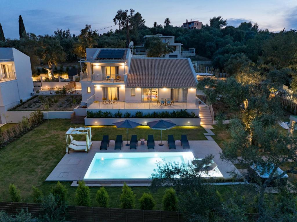 an aerial view of a house with a swimming pool at CorfuVille Luxury Villas in Danilia