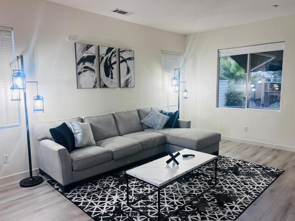 a living room with a couch and a coffee table at Stylish & Fully Renovated Home! in Oxnard