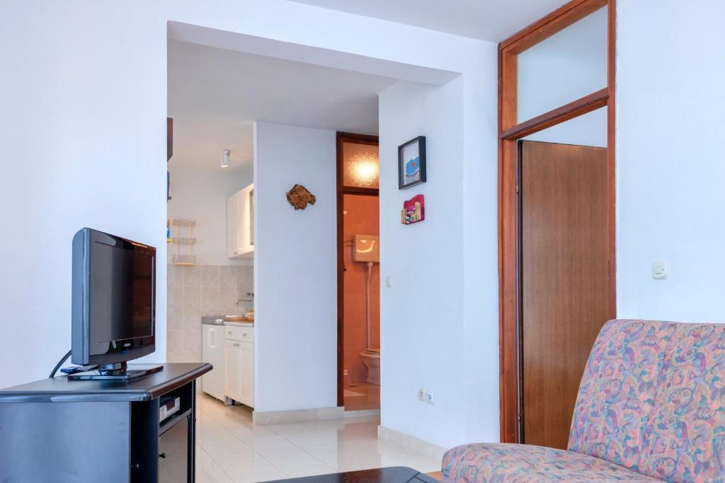 Telewizja i/lub zestaw kina domowego w obiekcie MI Apartment