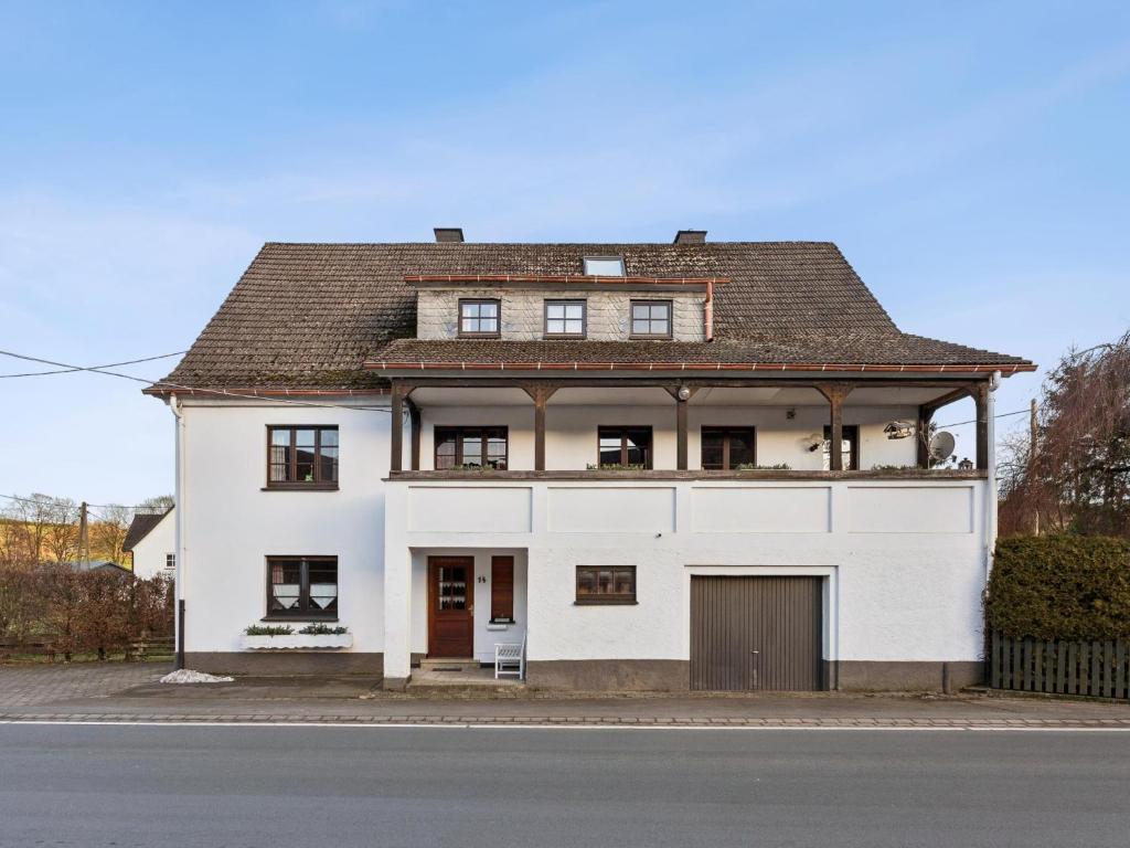 a white house with a brown roof at Schwermann in Schmallenberg