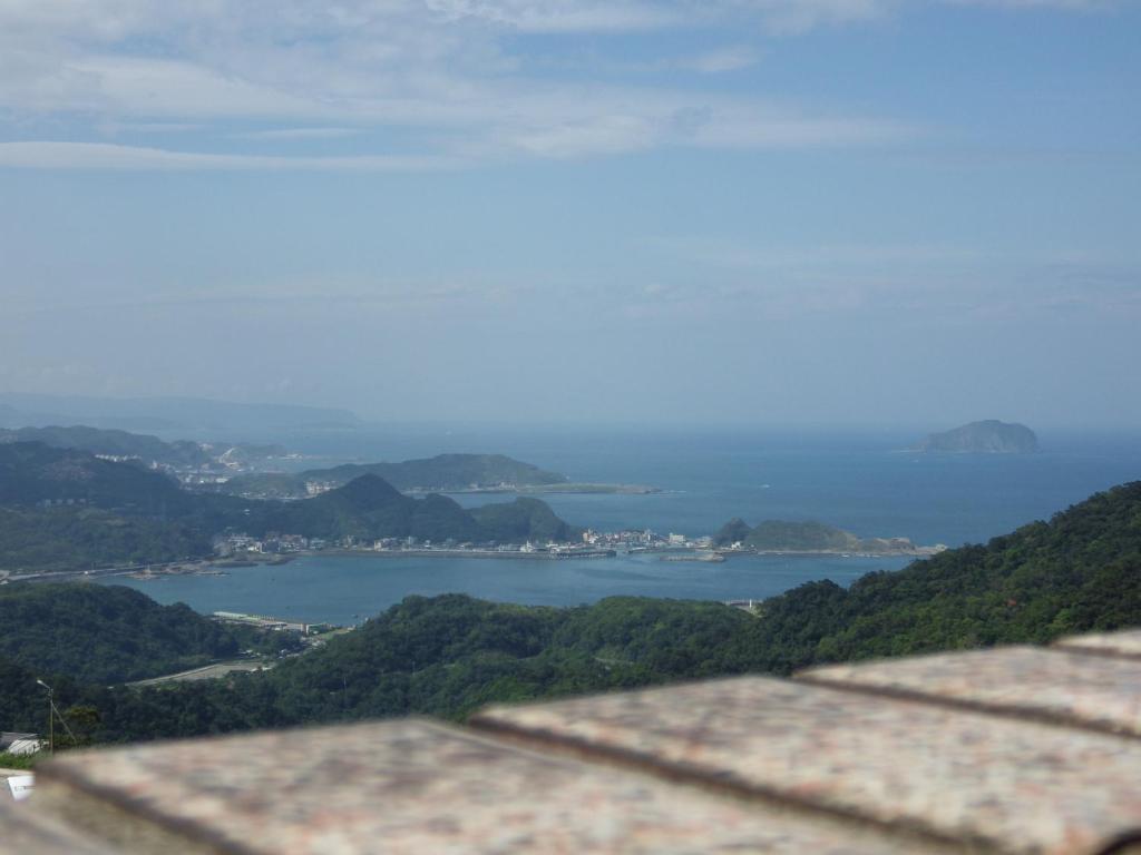 a view of a body of water from a mountain at Jiufen Hui Ming Homestay in Jiufen
