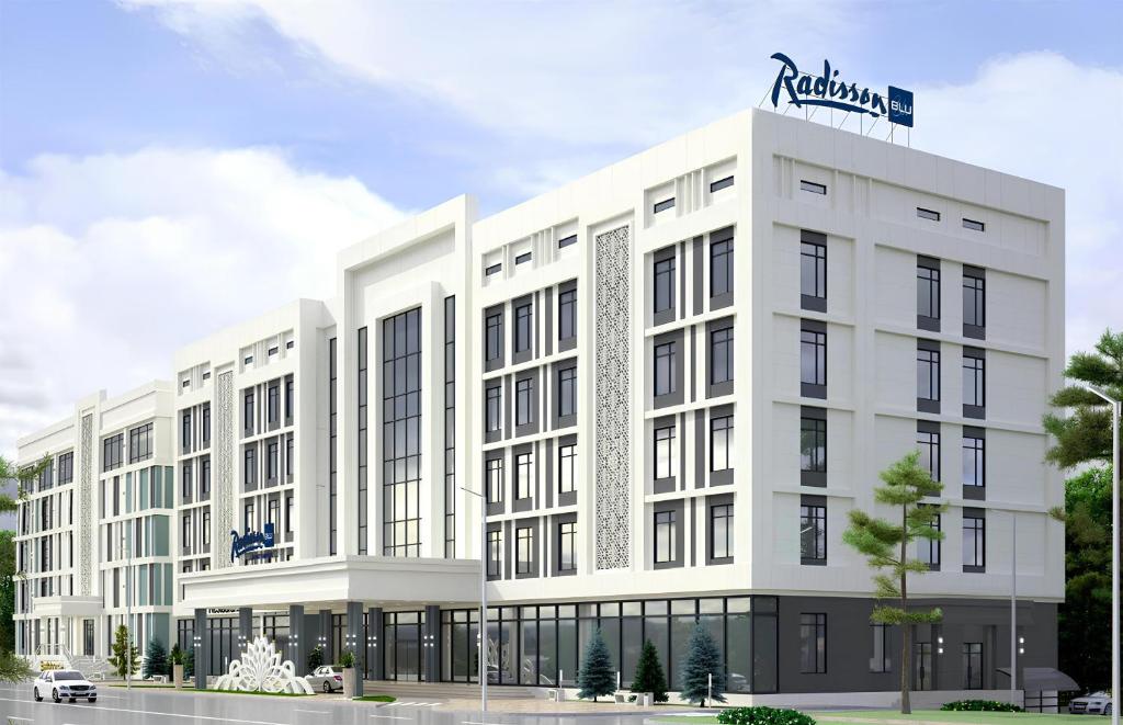 a rendering of a white building with a sign on top at Radisson Blu Hotel, Almaty Airport in Almaty