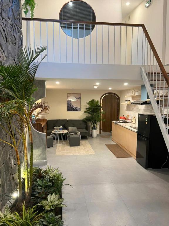 a kitchen and living room in a house at Dana Home MT in Danang