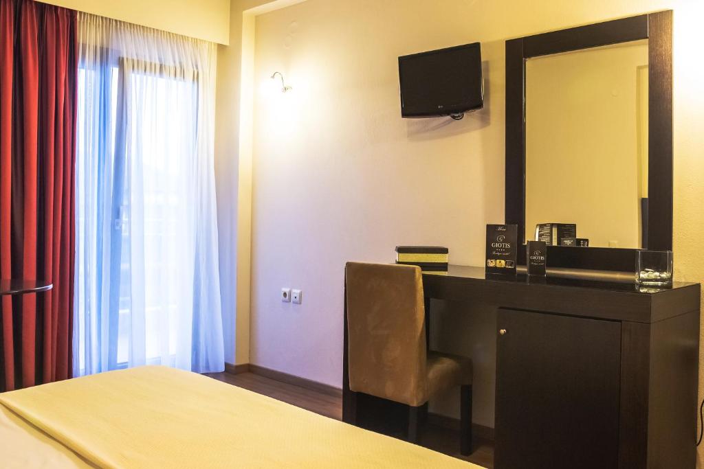 Postel nebo postele na pokoji v ubytování Giotis Boutique Hotel